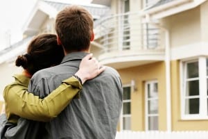 Young couple looking at an apartment block