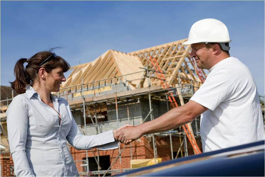 Builder and client on a building site