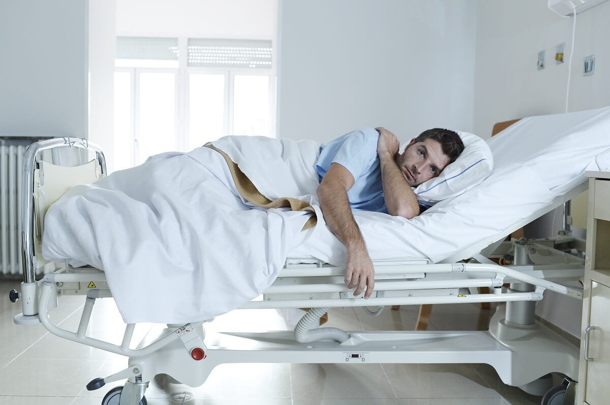 Man in hospital bed