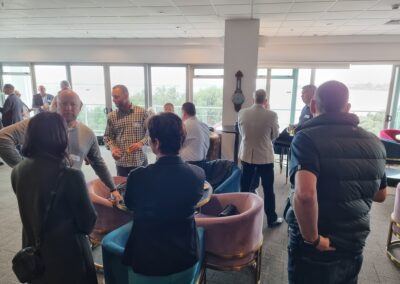 Attendees at meeting mix and mingle