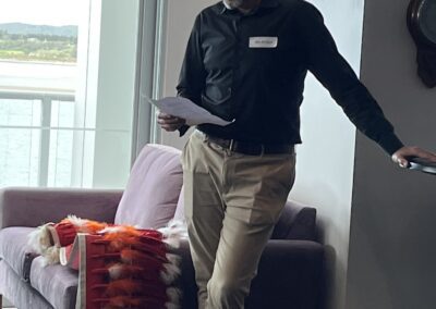 Man standing in living room reading